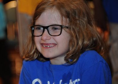 Young girl with glasses laughing