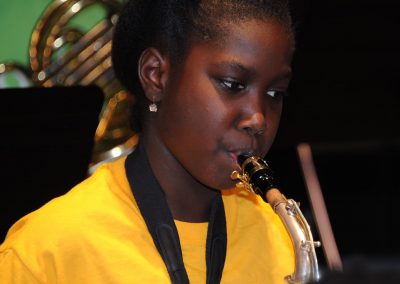 Girl playing brass instrument