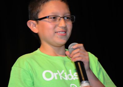 Young Boy Holding Microphone