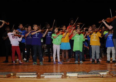 Young Kids Playing Violin along with Teacher