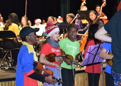 OrKidstra junior violin students onstage at the Holiday Concert