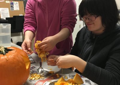Kids carving pumpkins