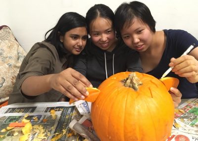 Kids carving pumpkins